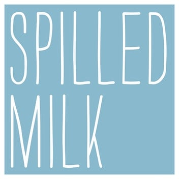 The cover art for Spilled Milk. The podcast's title is written in a tall, thin, all-caps sans-serif font on a pale blue background.